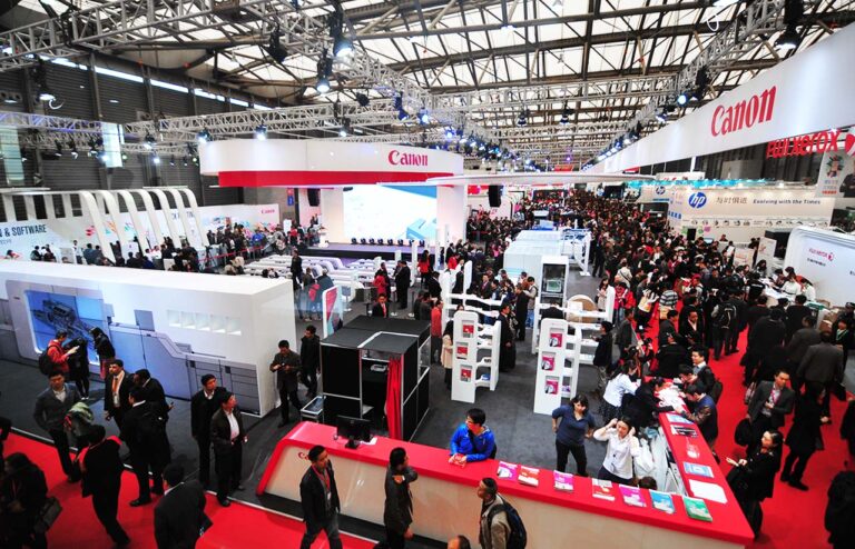 Visitors exploring the Canon exhibition environment designed by DiNicolaDesign Studio.