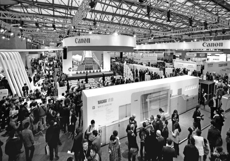 Visitors exploring the Canon exhibition environment designed by Di Nicola Design Studio.
